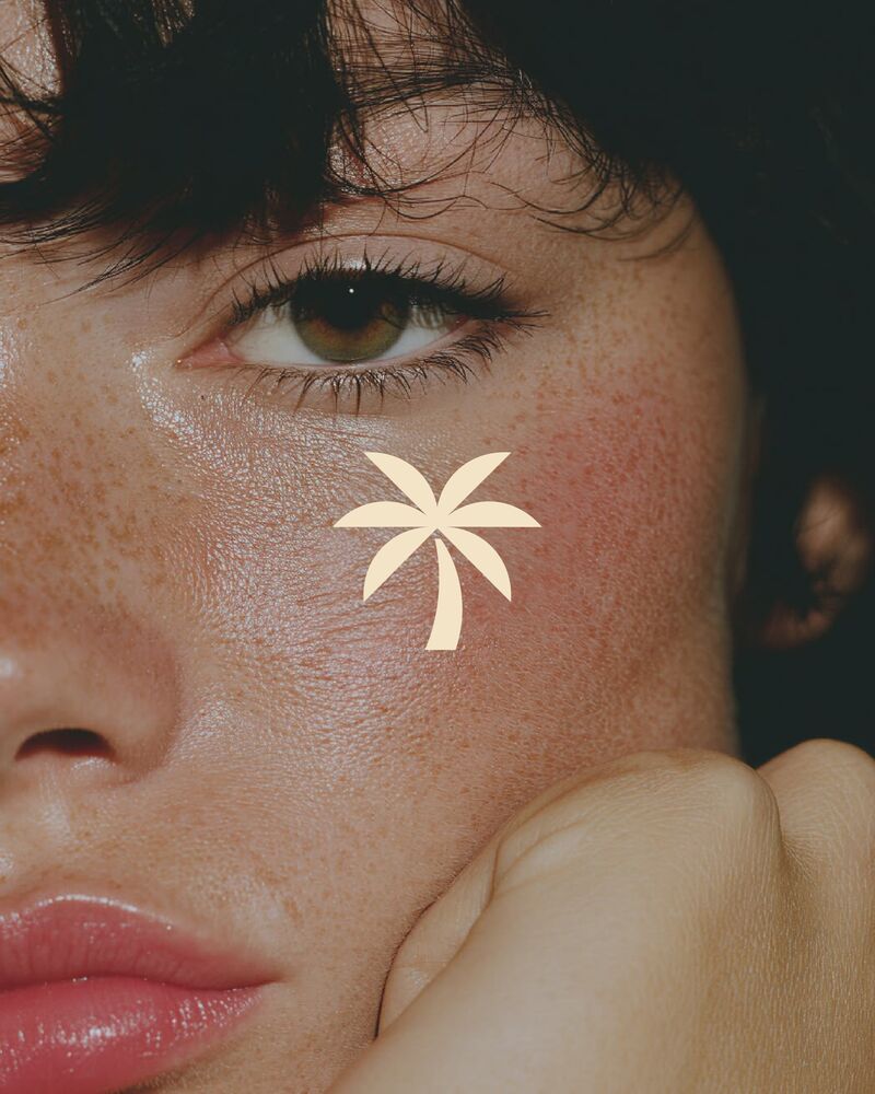 A face with the palm mark painted on the cheek