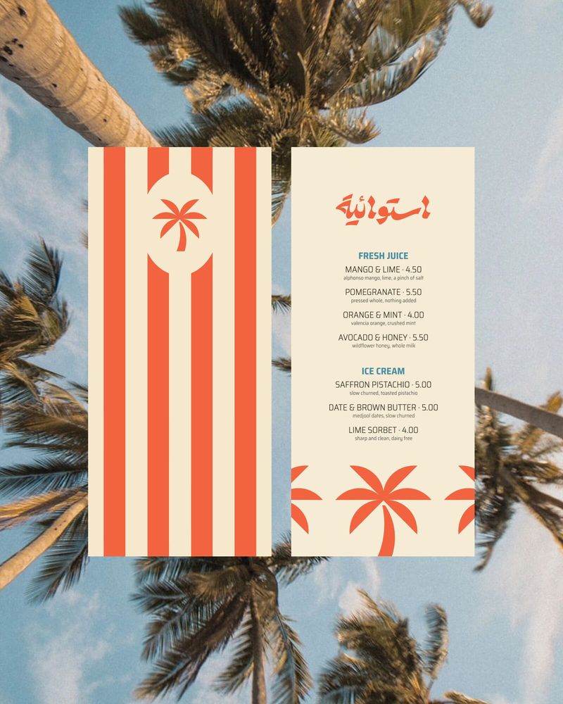 The printed Tropical menu under the palms